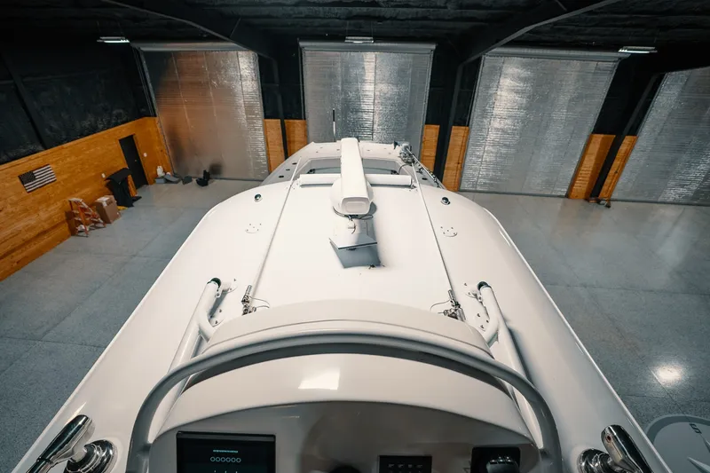 Slide: The Image of 2023 Freeman 42LR boat in spacious indoor storage facility. - 61