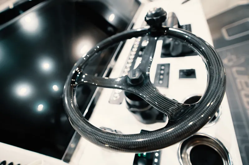 Slide: The Image of Carbon fiber steering wheel of 2023 Freeman 42LR boat, showcasing modern design and technology. - 72