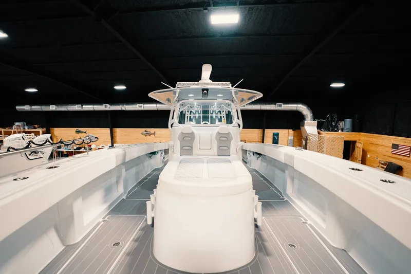 Slide: The Image of 2023 Freeman 42LR boat interior in a showroom, showcasing sleek design and spacious layout. - 78