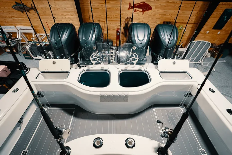 Slide: The Image of Freeman 42LR 2023 fishing boat interior with multiple rod holders and engines. - 47