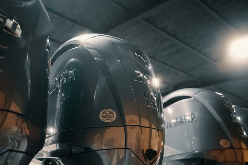 Slide: The Image of Outboard motors displayed in a showroom, featuring Freeman 42LR, 2023 model. - 38