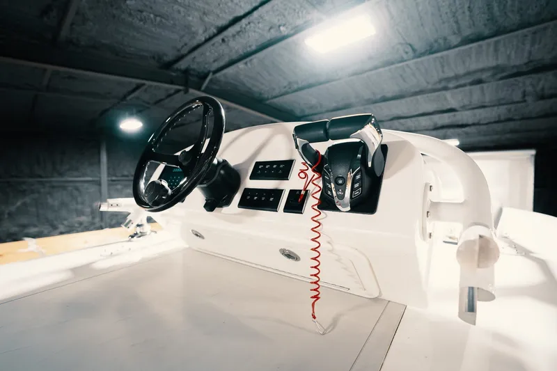 Slide: The Image of Steering console of 2023 Freeman 42LR boat, featuring modern controls and sleek design. - 63