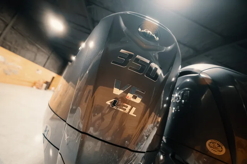 Slide: The Image of Freeman 42LR 2023 boat engine, 350 V6 4.3L, in a dimly lit garage. - 40