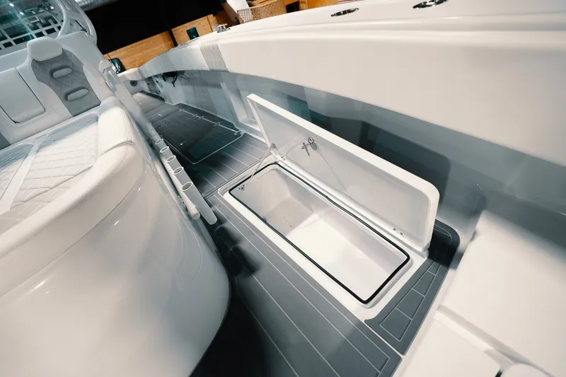 Slide: The Image of 2023 Freeman 42LR boat interior with open storage compartment and seating. - 87