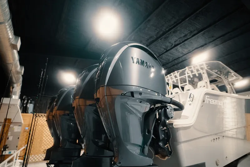 Slide: The Image of 2023 Freeman 42LR boat with Yamaha outboard engines in a showroom. - 41