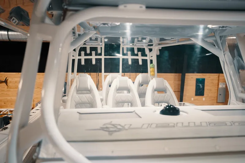 Slide: The Image of Interior view of a 2023 Freeman 42LR boat with white seating and modern design. - 81
