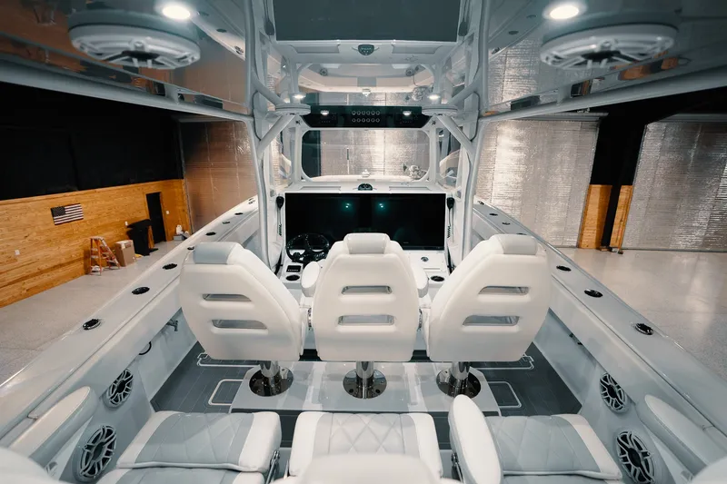 Slide: The Image of Interior of 2023 Freeman 42LR boat with modern seating and control panel. - 73
