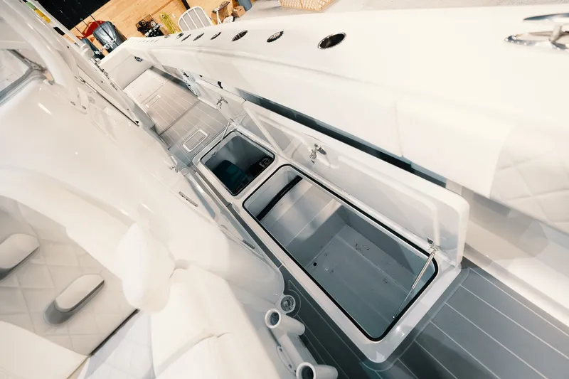 Slide: The Image of Interior view of 2023 Freeman 42LR boat, showcasing storage compartments and seating. - 88
