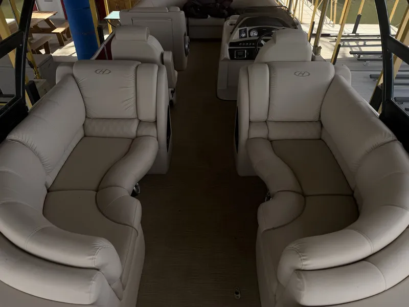 Slide: The Image of The image shows the interior of a 2017 Harris 250 GM with beige leather seating. - 15
