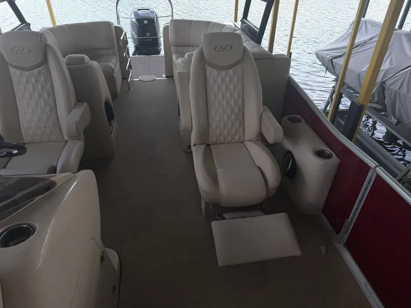 Slide: The Image of The image shows the interior of a 2017 Harris 250 GM with beige leather seats and a steering wheel. - 18