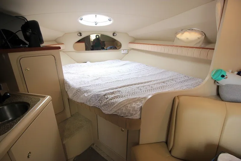 Slide: The Image of Interior cabin of 2001 Cruisers Yachts 2870 Express with bed and kitchenette. - 13
