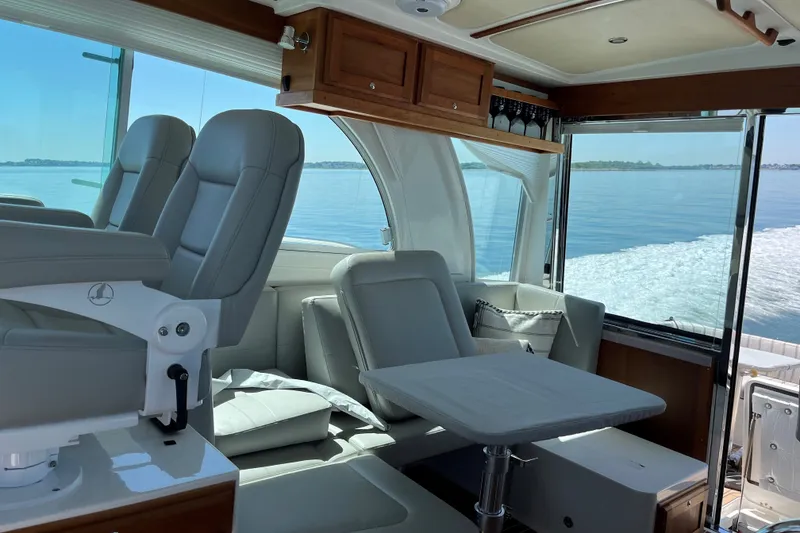 Slide: The Image of Luxurious interior of 2019 Back Cove 41 yacht with plush seating and ocean view. - 7