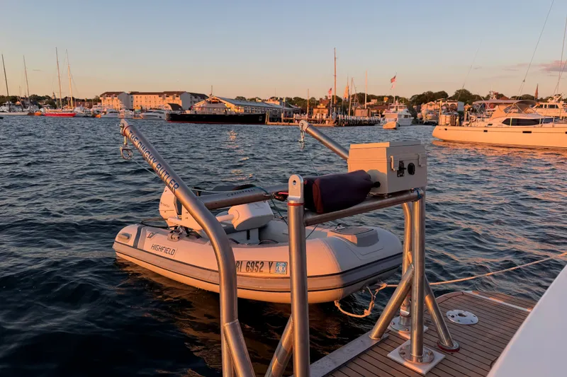 Slide: The Image of 2019 Back Cove 41 yacht with dinghy at sunset in a marina. - 13
