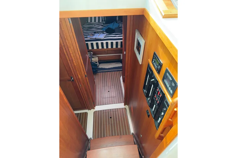 Slide: The Image of Interior view of 2019 Back Cove 41 yacht, featuring wooden stairs and cabin controls. - 9