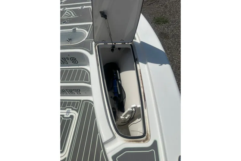 Slide: The Image of Open storage compartment on a 2018 Sea Pro 248 Bay boat deck. - 37