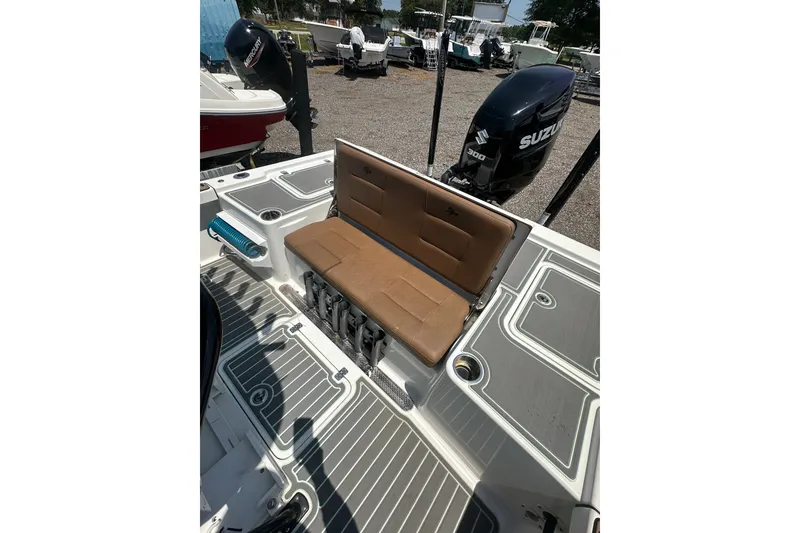 Slide: The Image of 2018 Sea Pro 248 Bay boat with Suzuki 300 engine, featuring a foldable tan seat. - 13