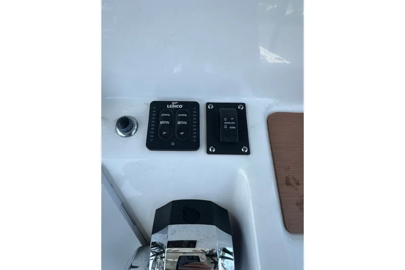 Slide: The Image of Control panel of a 2018 Sea Pro 248 Bay boat with Lenco switches. - 17
