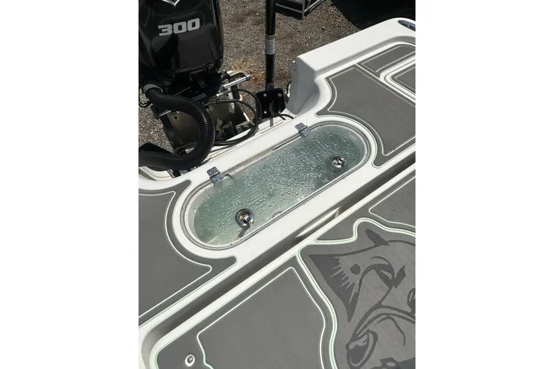 Slide: The Image of 2018 Sea Pro 248 Bay boat deck with livewell and 300 horsepower engine. - 14
