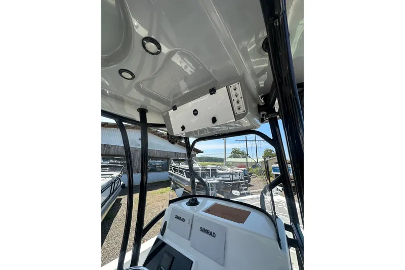 Slide: The Image of 2018 Sea Pro 248 Bay boat interior with control panel and electronics. - 21