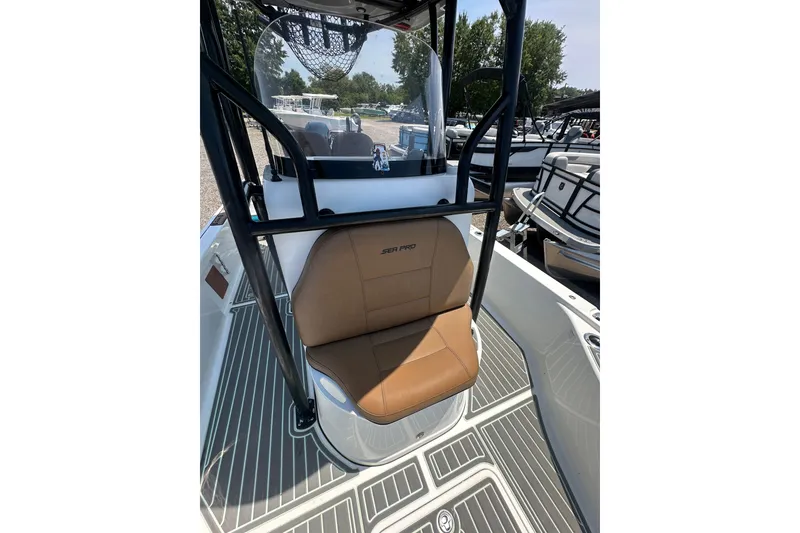 Slide: The Image of 2018 Sea Pro 248 Bay boat interior with tan seating and black frame. - 28