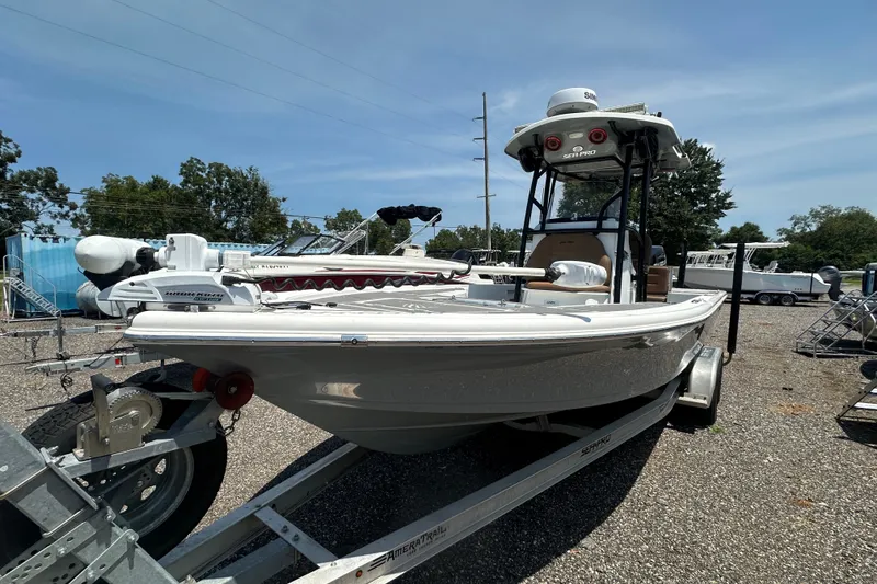 Slide: The Image of 2018 Sea Pro 248 Bay boat on trailer in outdoor setting. - 12
