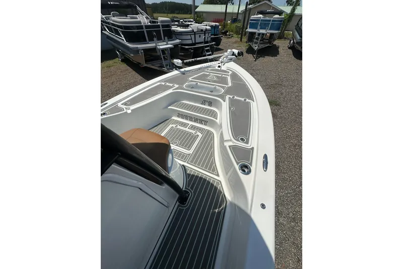 Slide: The Image of 2018 Sea Pro 248 Bay boat deck with sleek design and modern features. - 23