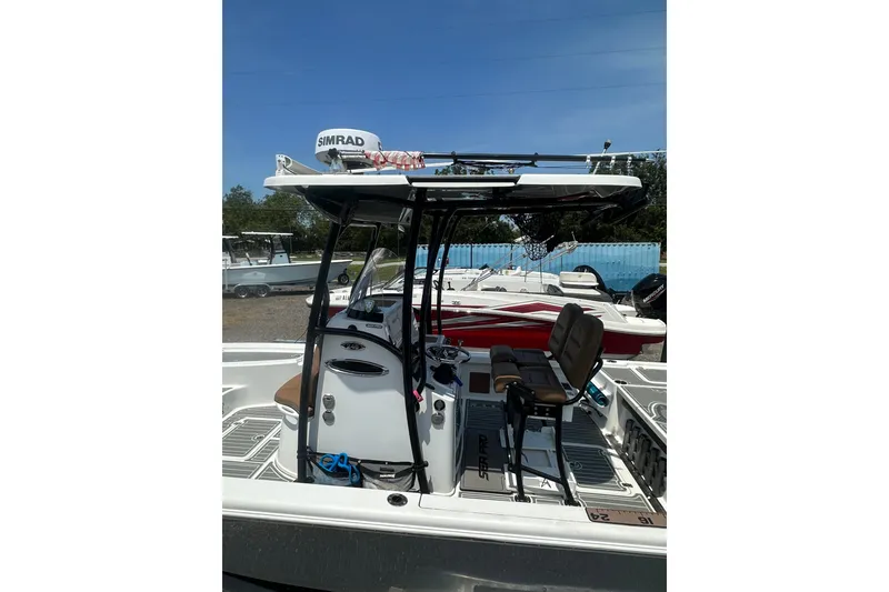 Slide: The Image of 2018 Sea Pro 248 Bay boat with Simrad electronics, docked outdoors. - 36