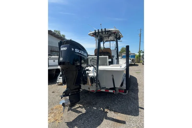 Slide: The Image of 2018 Sea Pro 248 Bay boat with Suzuki 300 outboard motor, parked outdoors. - 5
