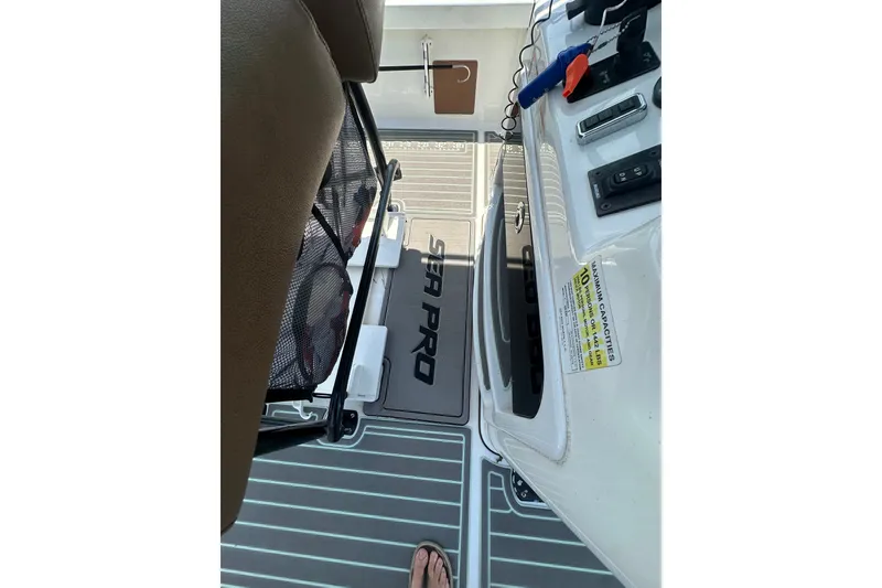 Slide: The Image of 2018 Sea Pro 248 Bay boat interior with seating and control panel. - 31