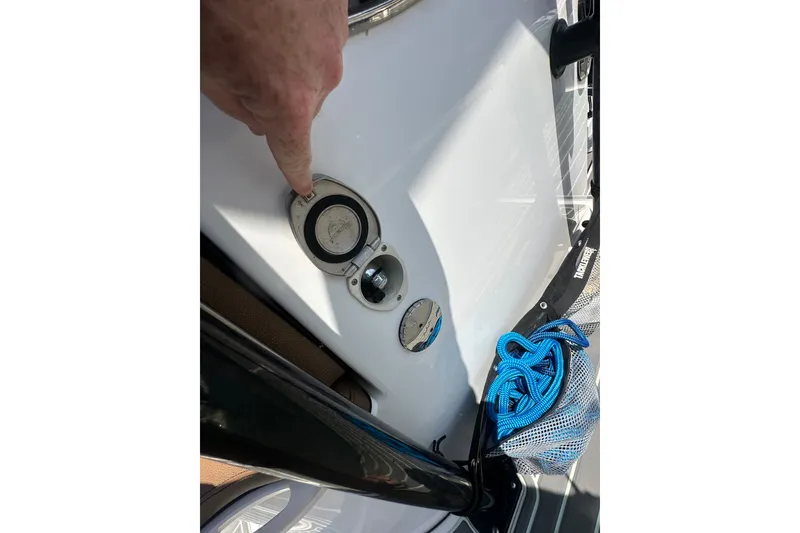 Slide: The Image of 2018 Sea Pro 248 Bay boat fuel cap with blue rope and mesh bag. - 26