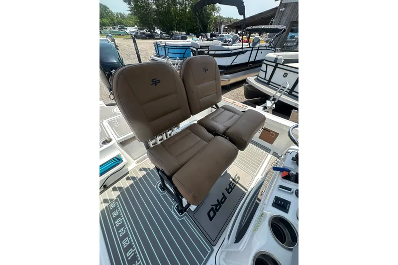 Slide: The Image of Brown seats on a 2018 Sea Pro 248 Bay boat, featuring a sleek deck design. - 30