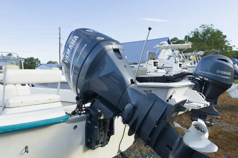 Slide: The Image of 2008 Sundance B20CCR boat with Yamaha outboard motor in a marina setting. - 7