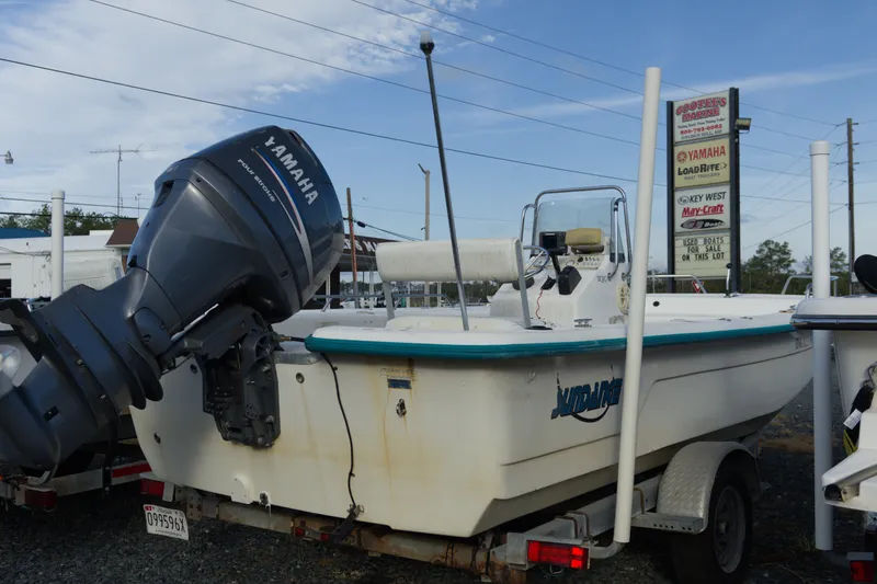Slide: The Image of 2008 Sundance B20CCR boat with Yamaha outboard motor on trailer, parked at dealership. - 4
