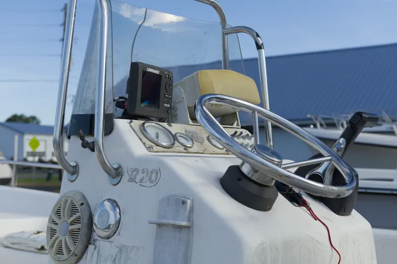 Slide: The Image of Center console of a 2008 Sundance B20CCR boat with steering wheel and navigation equipment. - 8