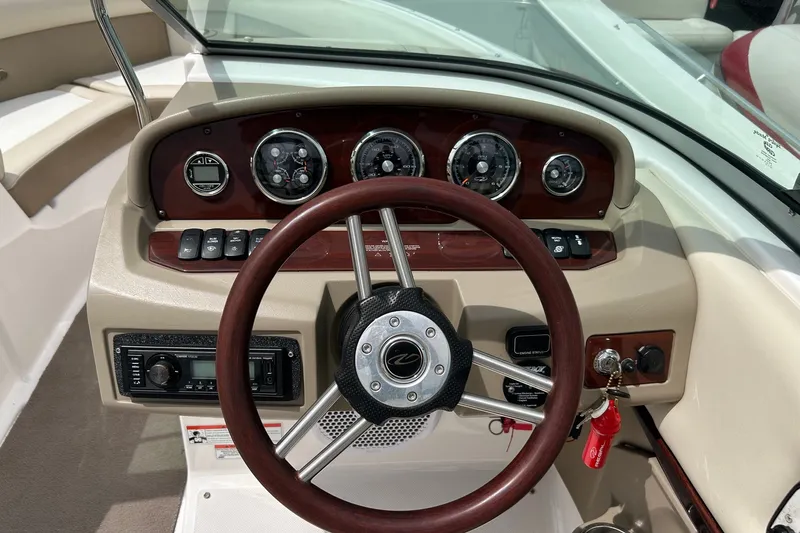Slide: The Image of 2011 Regal 2100 Bowrider dashboard with steering wheel and instrument panel. - 4