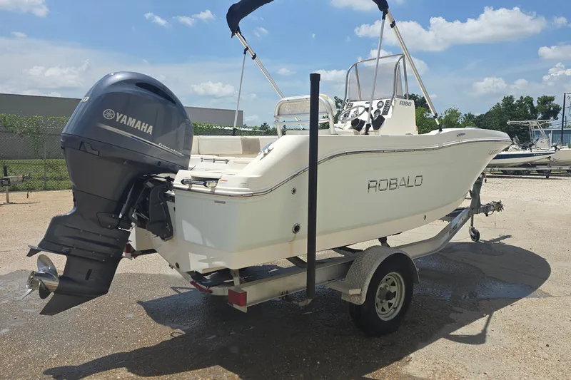 Slide: The Image of 2018 Robalo R180 Center Console boat with Yamaha engine on trailer. - 3