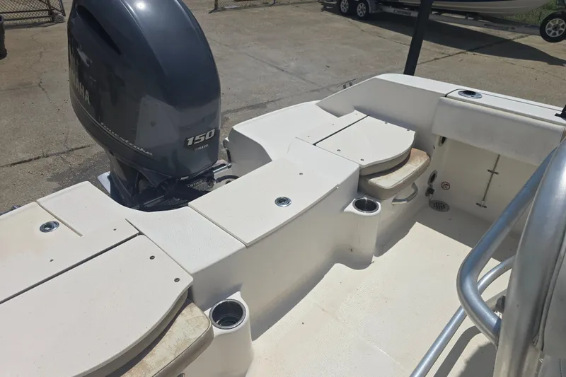 Slide: The Image of 2018 Robalo R180 Center Console boat with Yamaha 150 engine, featuring spacious deck layout. - 8
