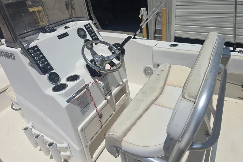 Slide: The Image of 2018 Robalo R180 Center Console boat interior with steering wheel and seating. - 10
