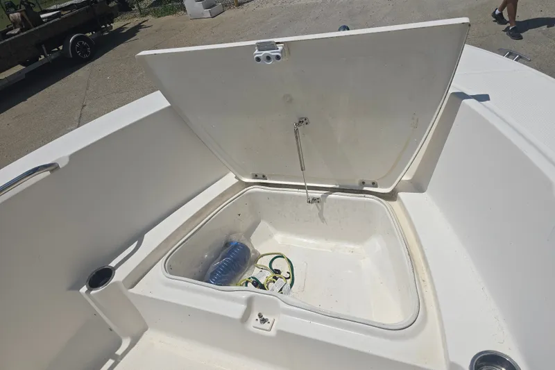 Slide: The Image of Open storage compartment on 2018 Robalo R180 Center Console boat. - 7