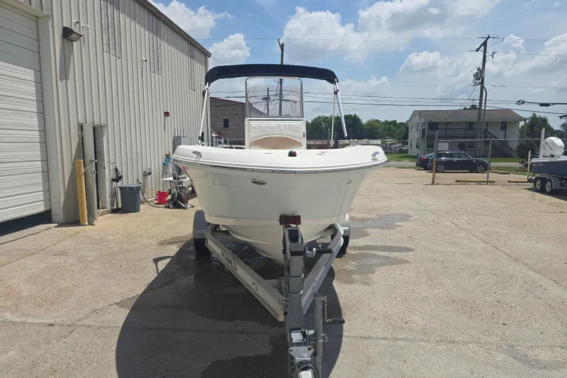 Slide: The Image of 2018 Robalo R180 Center Console boat on trailer in outdoor storage area. - 5