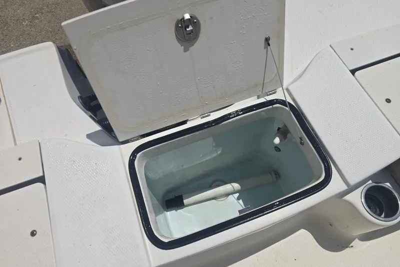 Slide: The Image of Open storage compartment on 2018 Robalo R180 Center Console boat deck. - 9
