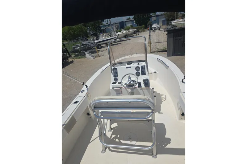 Slide: The Image of 2018 Robalo R180 Center Console boat interior with steering wheel and controls. - 12