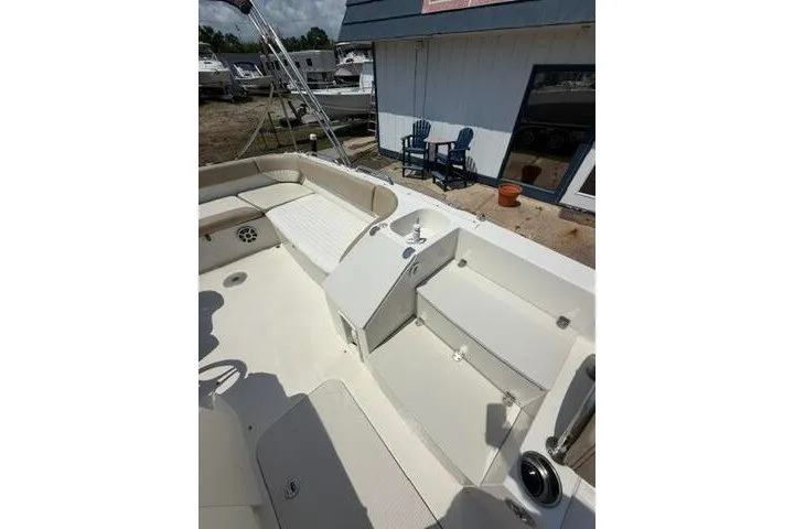Slide: The Image of 2018 Stingray 212 SC boat interior with spacious seating and modern design. - 17