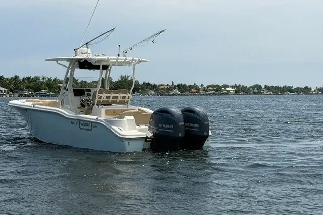 Slide: The Image of 2018 Key West 263 FS boat with twin Yamaha engines on open water. - 5