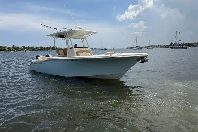 Slide: The Image of 2018 Key West 263 FS boat on calm water under a partly cloudy sky. - 2