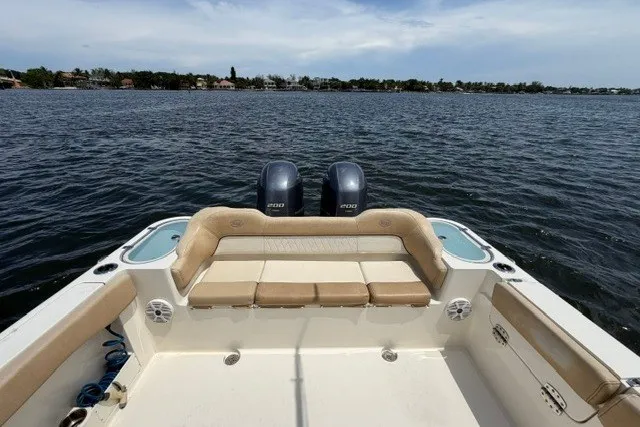 Slide: The Image of 2018 Key West 263 FS boat with dual engines on a calm lake. - 11