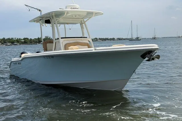 Slide: The Image of 2018 Key West 263 FS boat on water, featuring sleek design and Garmin equipment. - 1