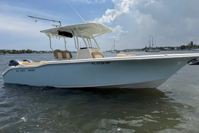 The Image of 2018 Key West 263 FS boat on water, clear sky, distant sailboats. - 0