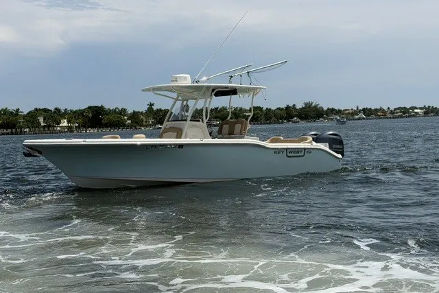Slide: The Image of 2018 Key West 263 FS boat cruising on a calm waterway. - 4