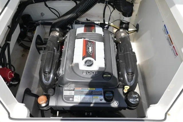 Slide: The Image of 2024 Bayliner VR5 Bowrider I/O engine compartment with Mercury 4.5L 200 HP engine. - 18